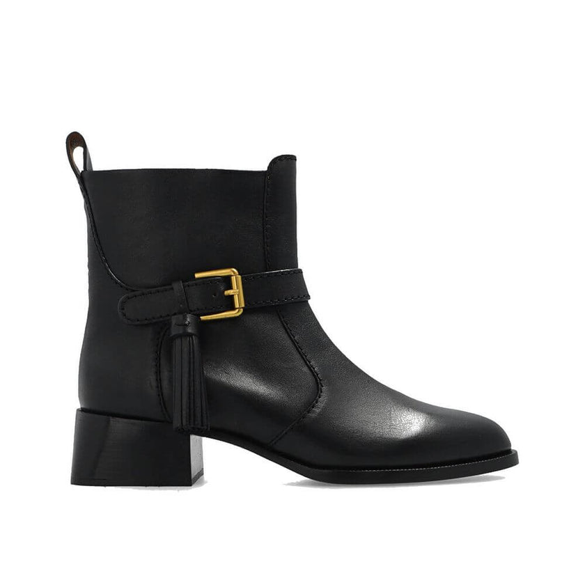 Black Calfskin Ankle BootsDescription: – Composition: 100% calf leather – Leather lining and insole – Rubber sole – Side zip fastening – Adjustable ankle strap – Made in Spain –Black Calfskin Ankle Boots${tagsSee By ChloéAulae Lory Leather Ankle Boots See