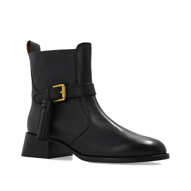 Black Calfskin Ankle BootsDescription: – Composition: 100% calf leather – Leather lining and insole – Rubber sole – Side zip fastening – Adjustable ankle strap – Made in Spain –Black Calfskin Ankle Boots${tagsSee By ChloéAulae Lory Leather Ankle Boots See