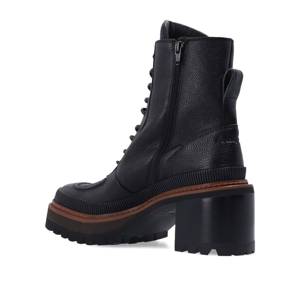 Black Calfskin Lace-Up BootsDescription: – Composition: 100% calf leather – Leather lining and insole – Rubber sole – Textured black leather – Lace-up fastening – Side zip fastening – Back logo detail – Heel 7 cm / 2,75 in – Made in Spain –Black Calfskin