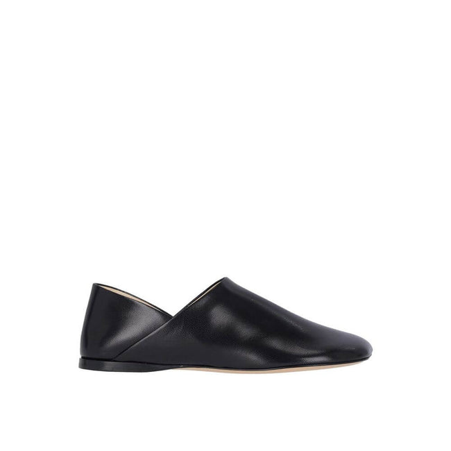 Black Lamb Leather Slip-On LoafersDescription: – Composition: 100% Lamb Leather – Inner: Leather – Insole: Leather – Sole: Leather – Square toe – Branded insole – Grained-effect – Slip-on design – Iconic petal shaped toe – Made in Italy – Gender: WOMEN –B