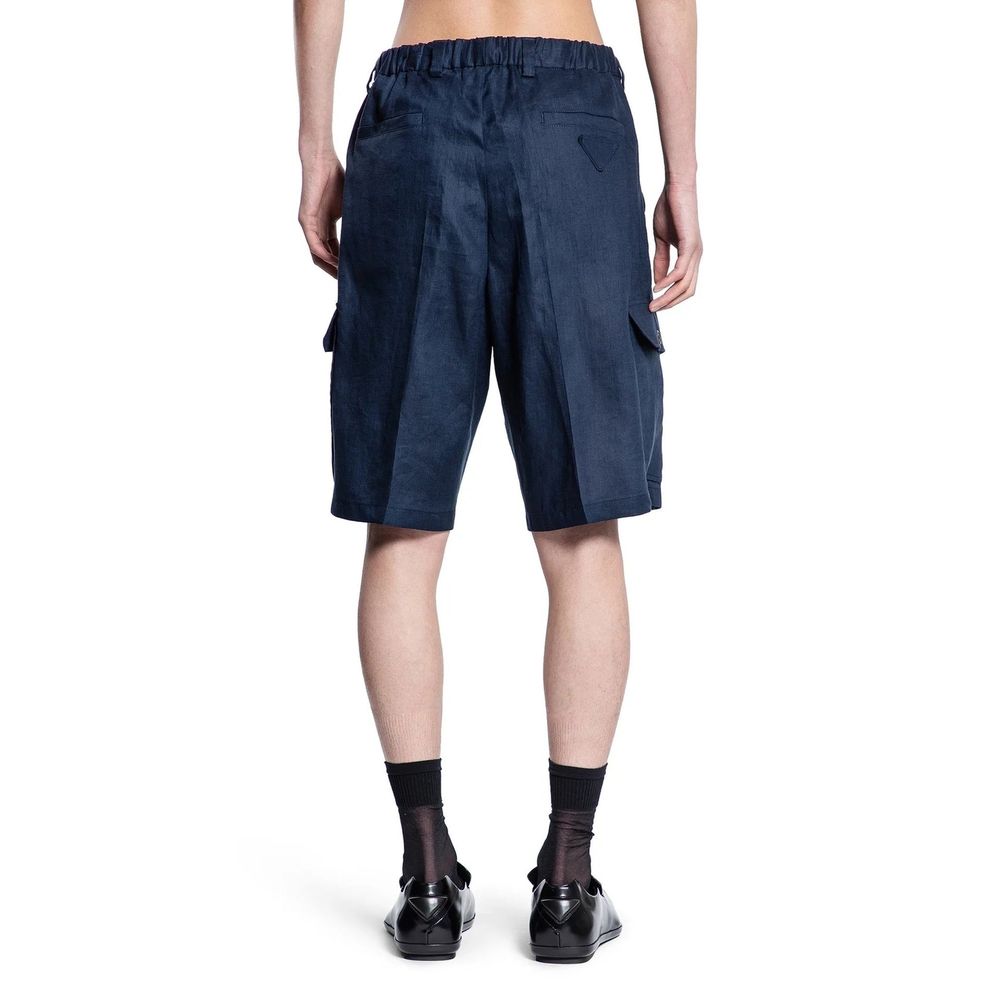 Blue Linen Bermuda ShortsDescription: – Composition: 100% Linen – Elasticated waist – Two side pockets – Belt loops – Machine wash – Two back pockets – Two patch pockets – Hook and button closure – Made in Italy – Gender: MEN –Blue Linen Bermuda Shorts${t