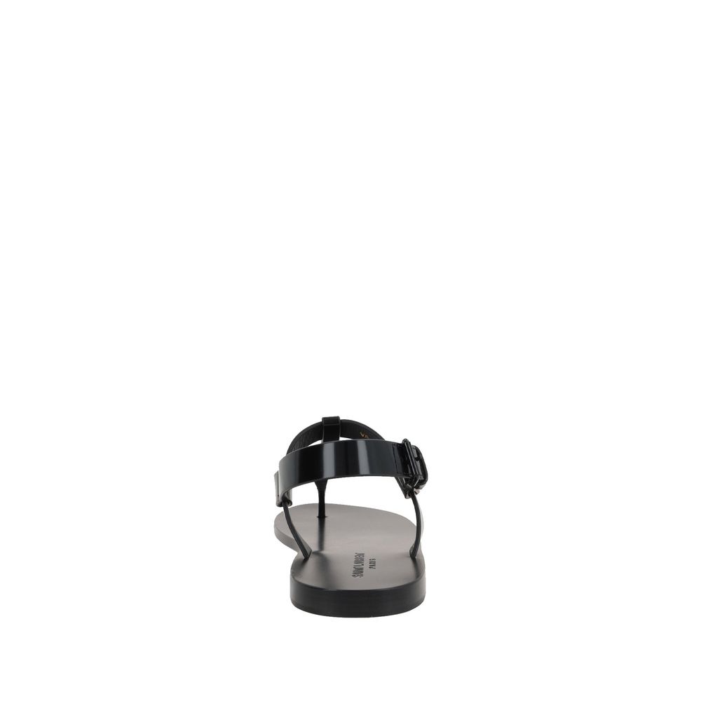 Black Calfskin Flat SandalsDescription: – Composition: 100% calf leather – Inner: Leather – Insole: Leather – Sole: Leather – Round toe – Patent effect – Adjustable buckle closure – Thong strap – Cassandre logo in enamelled metal – Made in Italy – Gender: