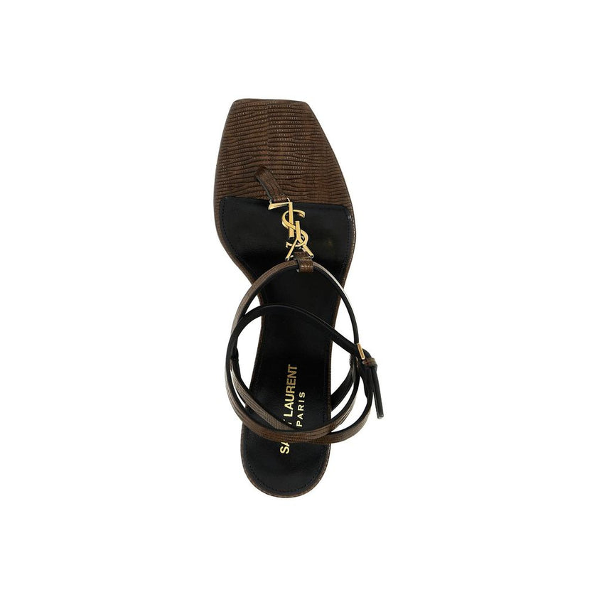 Brown Calfskin Platform SandalsDescription: – Composition: 100% calf leather – Inner: Leather – Insole: Leather – Sole: Leather – Square toe – Adjustable ankle buckle closure – Iconic YSL logo – Heel 6 cm – Made in Italy – Gender: WOMEN –Brown Calfskin Pl