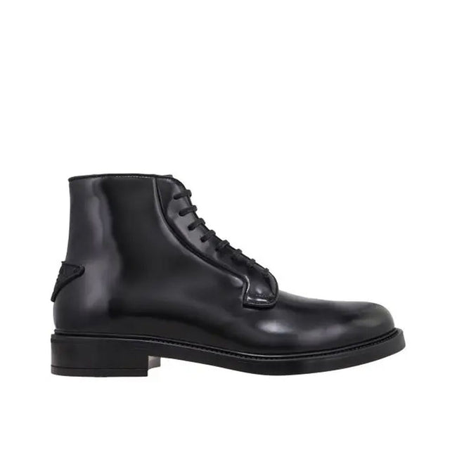Black Calfskin Lace-Up BootsDescription: – Composition: 100% calf leather – Inner: Leather – Insole: Leather – Sole: Rubber – Round toe – Back logo detail – Front lace-up closure – Made in Italy – Gender: MEN –Black Calfskin Lace-Up Boots${tagsPradaAulae