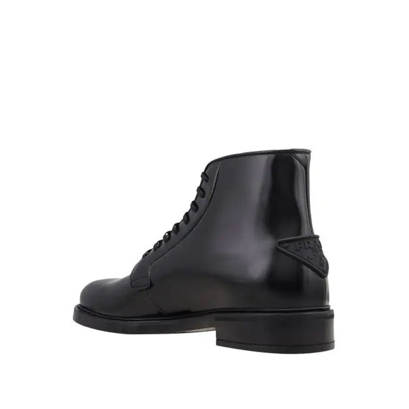 Black Calfskin Lace-Up BootsDescription: – Composition: 100% calf leather – Inner: Leather – Insole: Leather – Sole: Rubber – Round toe – Back logo detail – Front lace-up closure – Made in Italy – Gender: MEN –Black Calfskin Lace-Up Boots${tagsPradaAulae