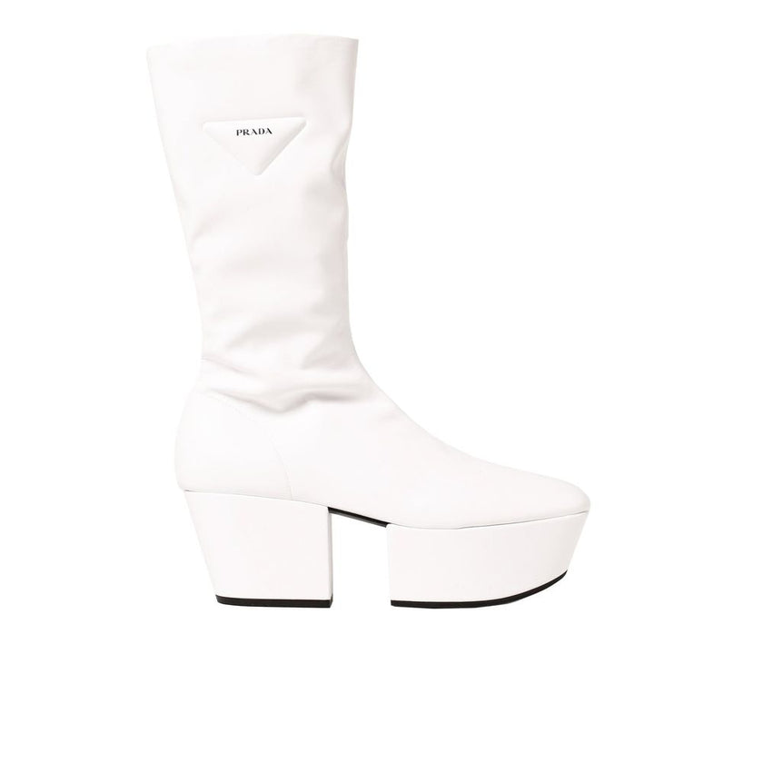 White Polyethylene BootsDescription: – Composition: 100% Polyurethane – Rubber sole – Rounded toeline – Side zip fastening – Contrast logo detail – Flap 7.5 cm / 2,9 in – Made in Italy –White Polyethylene Boots${tagsPradaAulae Platform Pull On Boots Prada