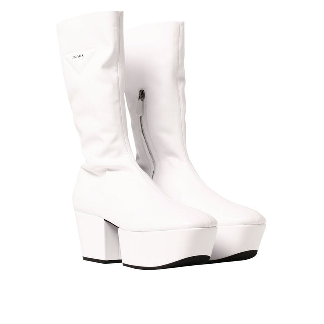 White Polyethylene BootsDescription: – Composition: 100% Polyurethane – Rubber sole – Rounded toeline – Side zip fastening – Contrast logo detail – Flap 7.5 cm / 2,9 in – Made in Italy –White Polyethylene Boots${tagsPradaAulae Platform Pull On Boots Prada