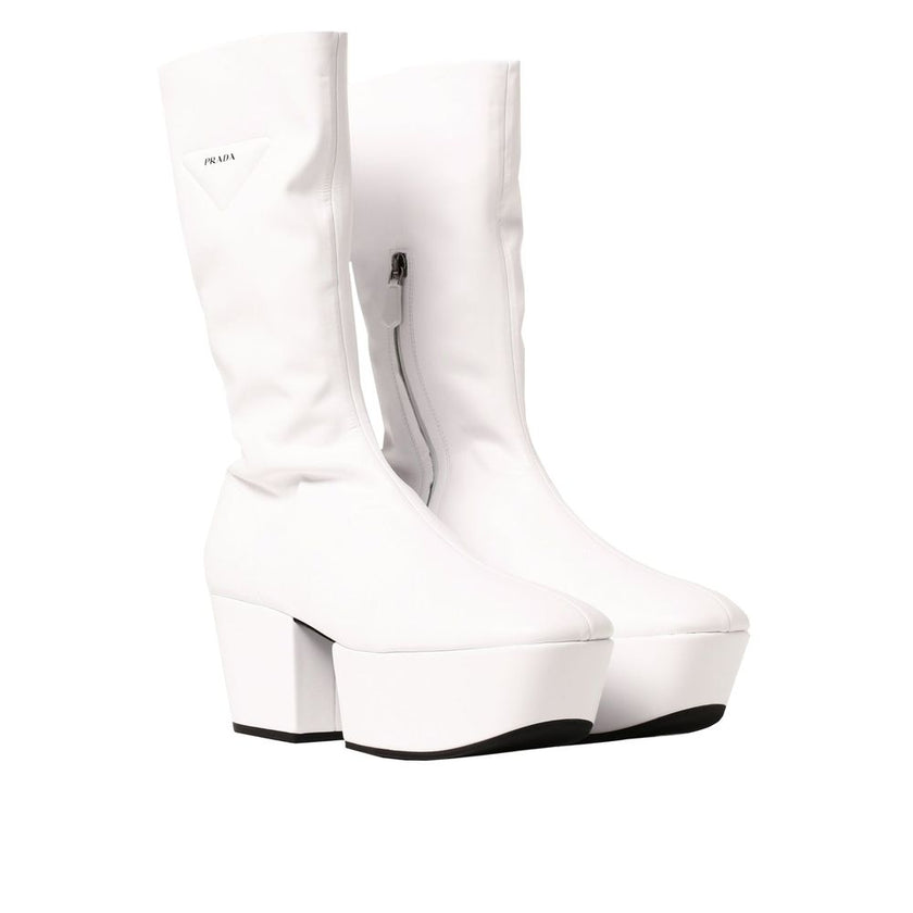 White Polyethylene BootsDescription: – Composition: 100% Polyurethane – Rubber sole – Rounded toeline – Side zip fastening – Contrast logo detail – Flap 7.5 cm / 2,9 in – Made in Italy –White Polyethylene Boots${tagsPradaAulae Platform Pull On Boots Prada