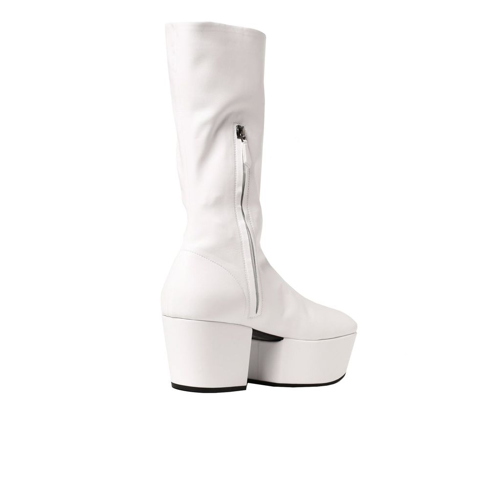 White Polyethylene BootsDescription: – Composition: 100% Polyurethane – Rubber sole – Rounded toeline – Side zip fastening – Contrast logo detail – Flap 7.5 cm / 2,9 in – Made in Italy –White Polyethylene Boots${tagsPradaAulae Platform Pull On Boots Prada