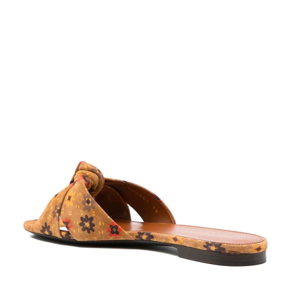 Brown Leather SlidesDescription: – Composition: 100% leather – Leather lining, insole, sole – Branded insole – Made in Italy –Brown Leather Slides${tagsSaint LaurentAulae Bianca Knotted Suede Slides Saint LaurentAulae Bianca Knotted Suede Slides Descripti