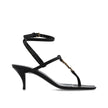 Black Calfskin Stiletto Heel SandalsDescription: – Composition: 100% calf leather – Leather lining, insole, sole – Ankle side buckle fastening – Square toe – Iconic YSL monogram – Heel 6 cm / 2,3 in – Made in Italy –Black Calfskin Stiletto Heel Sandals${t