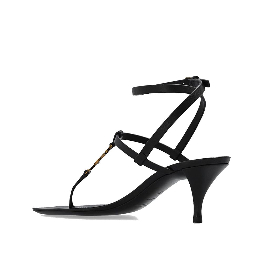Black Calfskin Stiletto Heel SandalsDescription: – Composition: 100% calf leather – Leather lining, insole, sole – Ankle side buckle fastening – Square toe – Iconic YSL monogram – Heel 6 cm / 2,3 in – Made in Italy –Black Calfskin Stiletto Heel Sandals${t
