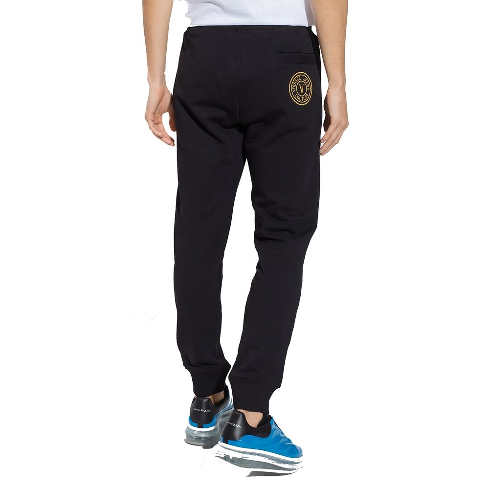 Black Cotton Joggers (Workout Pants)Description: – Composition: 100% Cotton – Elasticated waist – Two side pockets – Embroidered logo detail – Model is 193 cm tall wears size L – Made in Turkey – Gender: MEN –Black Cotton Joggers (Workout Pants)${tagsVers