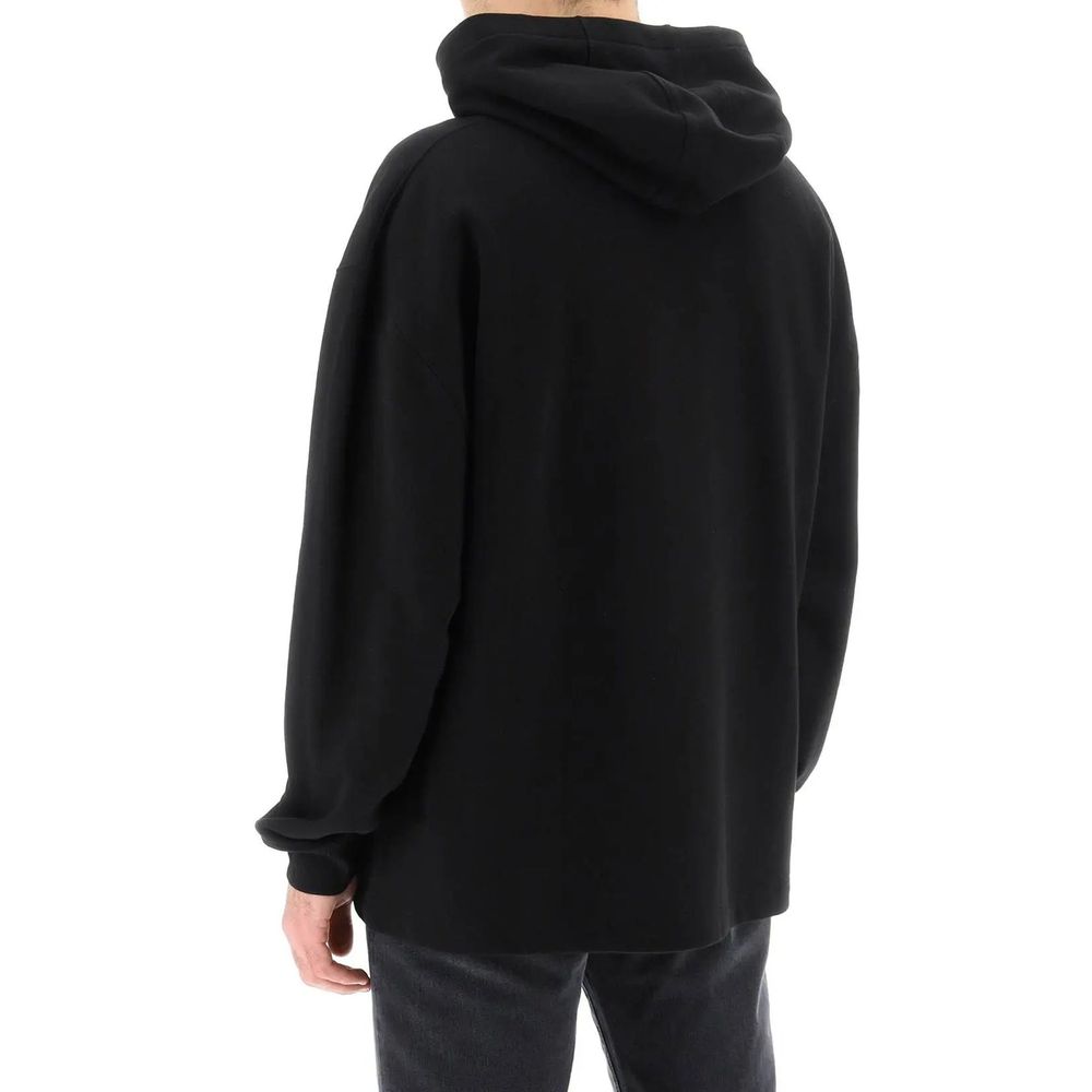 Black Cotton SweatshirtDescription: – Composition: 100% Cotton – Ribbed trims – Machine wash – Kangaroo pocket – Front logo relief – Non detachable hood – Gender: MEN –Black Cotton Sweatshirt${tagsVersaceAulae Varsity Hooded Sweatshirt VersaceAulae Varsit