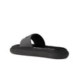 Black Rubber SlidesDescription: – Composition: 100% rubber – Leather insole – Rubber Sole – Relief logo detail – Made in Italy –Black Rubber Slides${tagsMonclerAulae Logo Slides MonclerAulae Logo Slides Description: – Composition: 100% rubber – Leather in