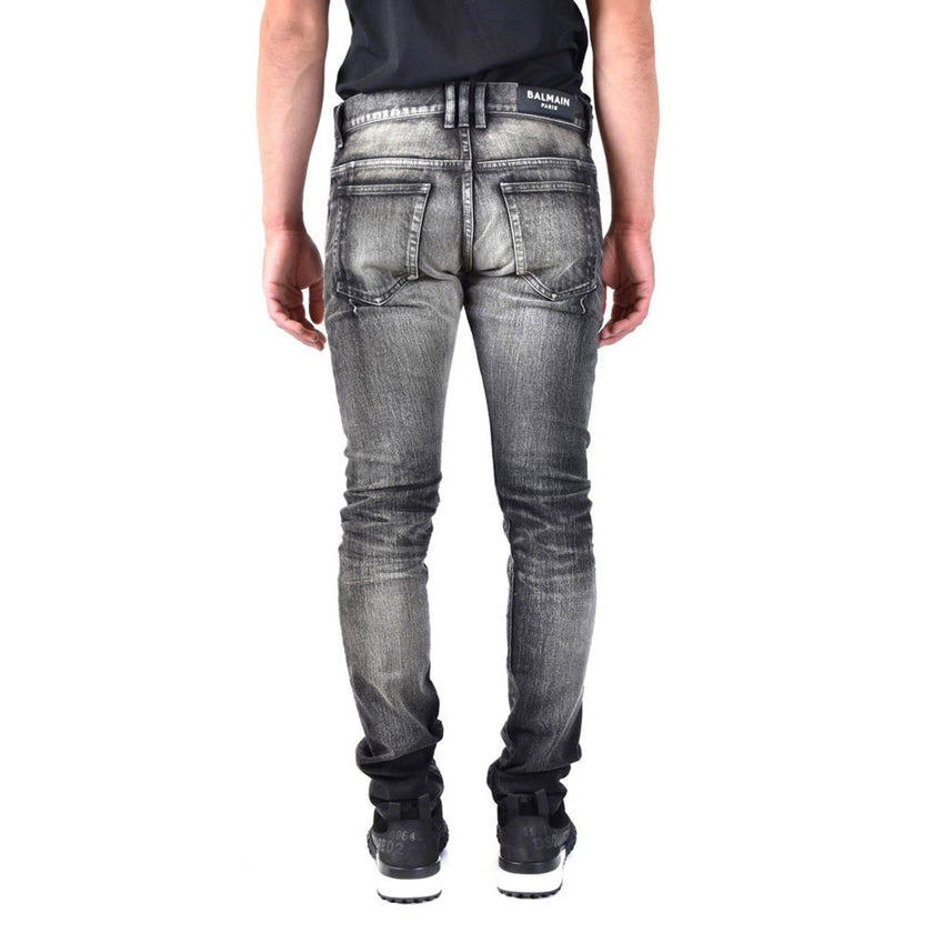 Black Cotton Skinny JeansDescription: – Composition: 100% Cotton – Five pockets – Fastened with a button and zipper – Gender: MEN –Black Cotton Skinny Jeans${tagsBalmainAulae Distressed Jeans BalmainAulae Distressed Jeans Description: – Composition: 100%