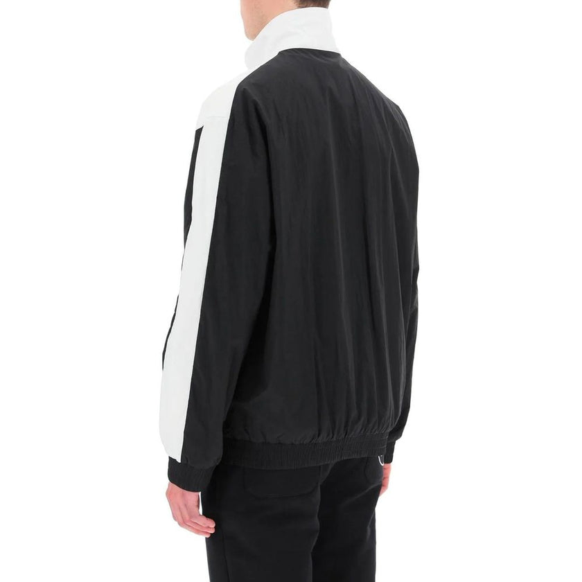 Black Polyamide Shell JacketDescription: – Composition: 100% Polyamide – Long sleeves – Two side pockets – Elasticated cuffs – Front zip closure – Front logo detail – Gender: MEN –Black Polyamide Shell Jacket${tagsBalmainAulae Logo Windbreaker BalmainAula
