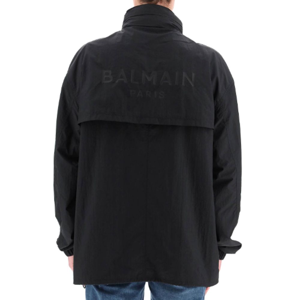 Black Nylon Shell JacketDescription: – Composition: 100% Nylon – Long sleeves – Machine wash – Logo patch – Front double slider zip closure – Foldable Hood – Gender: MEN –Black Nylon Shell Jacket${tagsBalmainAulae Nylon Logo Jacket BalmainAulae Nylon Logo
