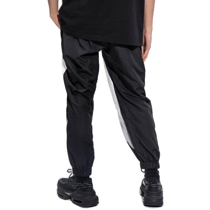 Black Polyester Joggers (Workout Pants)Description: – Composition: 100% Polyester – Two side pockets – Block colour effect – Machine wash (delicate) – Drawstring waist with Balmain Paris logo – Made in Italy – Gender: MEN – Size & Fit: This item fits true