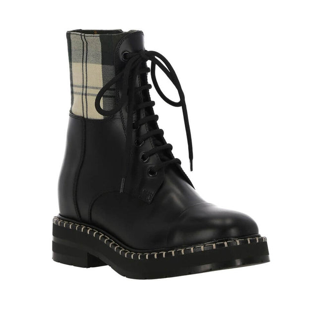 Black Cotton Lace-Up BootsDescription: – Composition: 35% Cotton 65% Polyester – Inner: Cotton – Insole: Leather – Sole: Rubber – Heel: 3.0 cm / 7.62 in – side zip closure – branded insole – Round toe – Made in Italy – Lace-up – Gender: WOMEN –Black Cotto