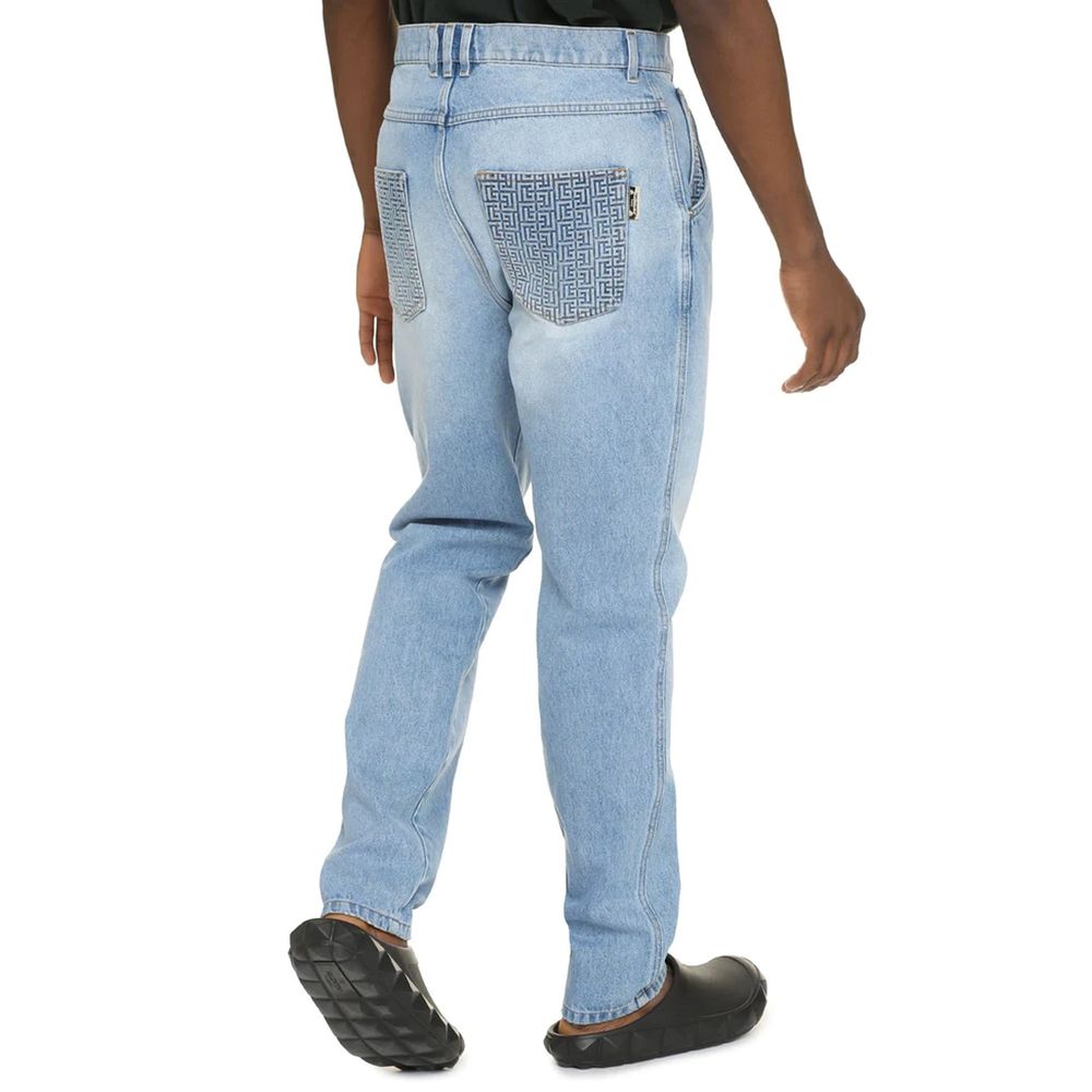 Blue Cotton Cropped JeansDescription: – Composition: 100% Cotton – Front button closure – Belt loops – Five pockets – Contrast stitching – Machine wash (delicate) – Medium waist – Made in Italy – Gender: MEN – Size & Fit: Model bust measurements: 96 cm Mo