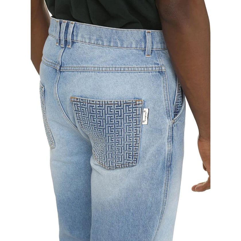 Blue Cotton Cropped JeansDescription: – Composition: 100% Cotton – Front button closure – Belt loops – Five pockets – Contrast stitching – Machine wash (delicate) – Medium waist – Made in Italy – Gender: MEN – Size & Fit: Model bust measurements: 96 cm Mo