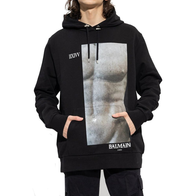 Black Cotton SweatshirtDescription: – Composition: 100% Cotton – Long sleeves – Ribbed trims – Machine wash – front logo detail – Drawstring hood – Kangaroo pocket – Made in Italy – Gender: MEN –Black Cotton Sweatshirt${tagsBalmainAulae Cotton Hoodie Swea