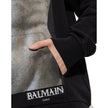 Black Cotton SweatshirtDescription: – Composition: 100% Cotton – Long sleeves – Ribbed trims – Machine wash – front logo detail – Drawstring hood – Kangaroo pocket – Made in Italy – Gender: MEN –Black Cotton Sweatshirt${tagsBalmainAulae Cotton Hoodie Swea