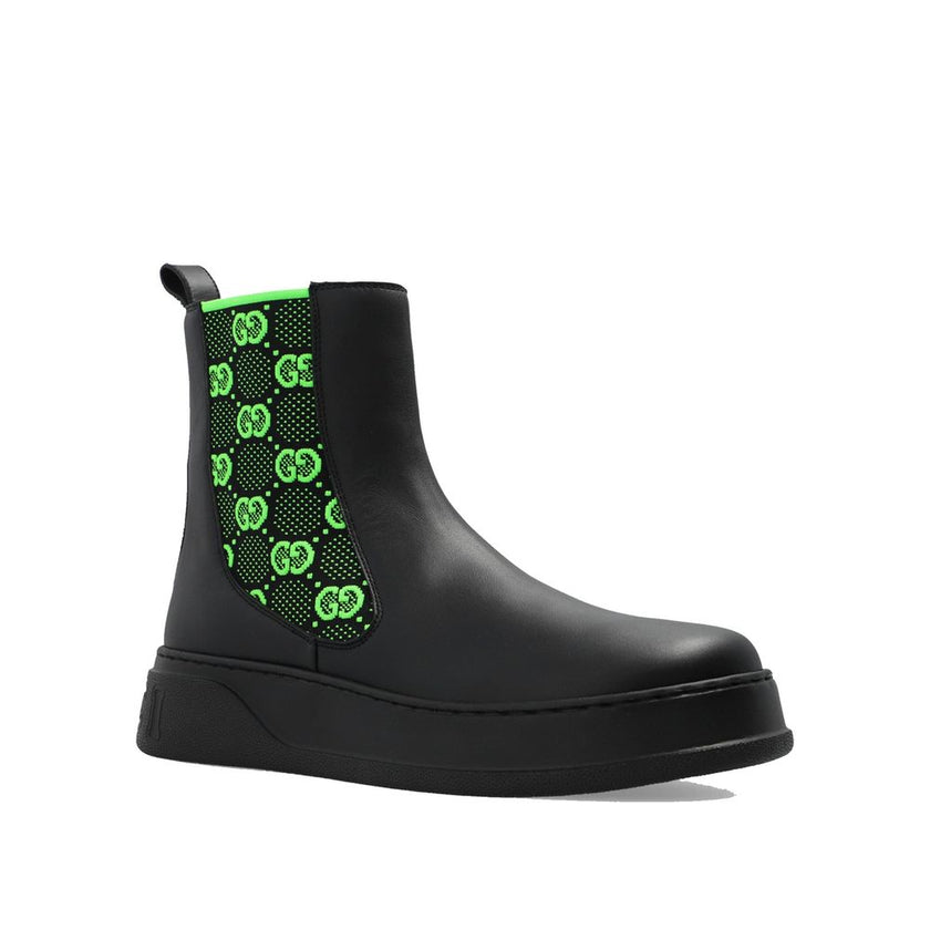 Black Leather Chelsea BootsDescription: – Composition: 100% Leather – Inner: 100% Leather – Insole: 100% Leather – Sole: 100% Rubber – pull tab at the rear – Round toe – elastic inserts for a slip-on design – high-top design – Embroidered monogram pattern
