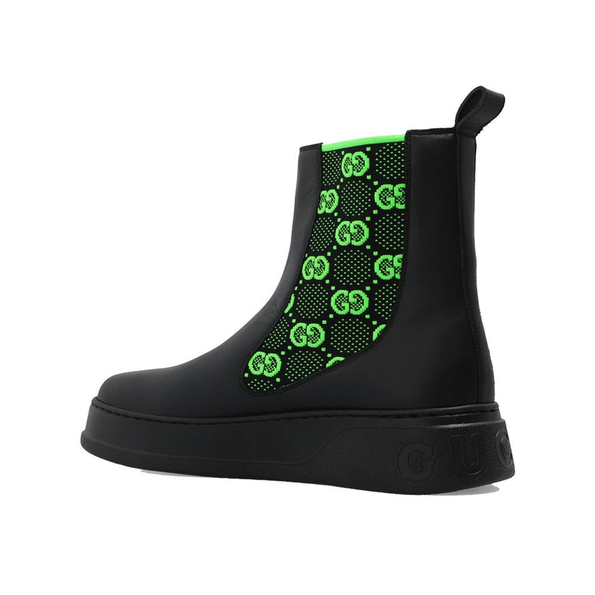 Black Leather Chelsea BootsDescription: – Composition: 100% Leather – Inner: 100% Leather – Insole: 100% Leather – Sole: 100% Rubber – pull tab at the rear – Round toe – elastic inserts for a slip-on design – high-top design – Embroidered monogram pattern