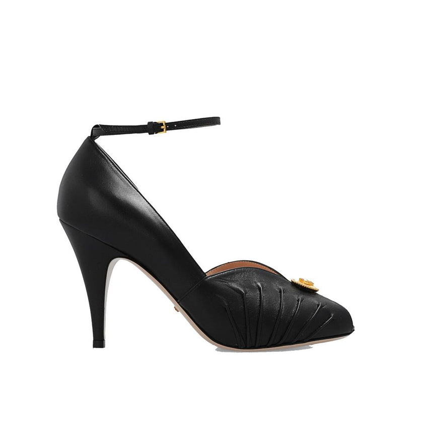 Black Leather High Heel PumpsDescription: – Composition: 100% Leather – Inner: 100% Leather – Insole: 100% Leather – Sole: 100% Leather – Heel: 10.0 cm / 25.4 in – branded insole – Open toe – Gold-colored metal application – ‘Interlocking G’ logo – Ankle