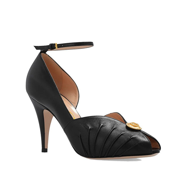 Black Leather High Heel PumpsDescription: – Composition: 100% Leather – Inner: 100% Leather – Insole: 100% Leather – Sole: 100% Leather – Heel: 10.0 cm / 25.4 in – branded insole – Open toe – Gold-colored metal application – ‘Interlocking G’ logo – Ankle