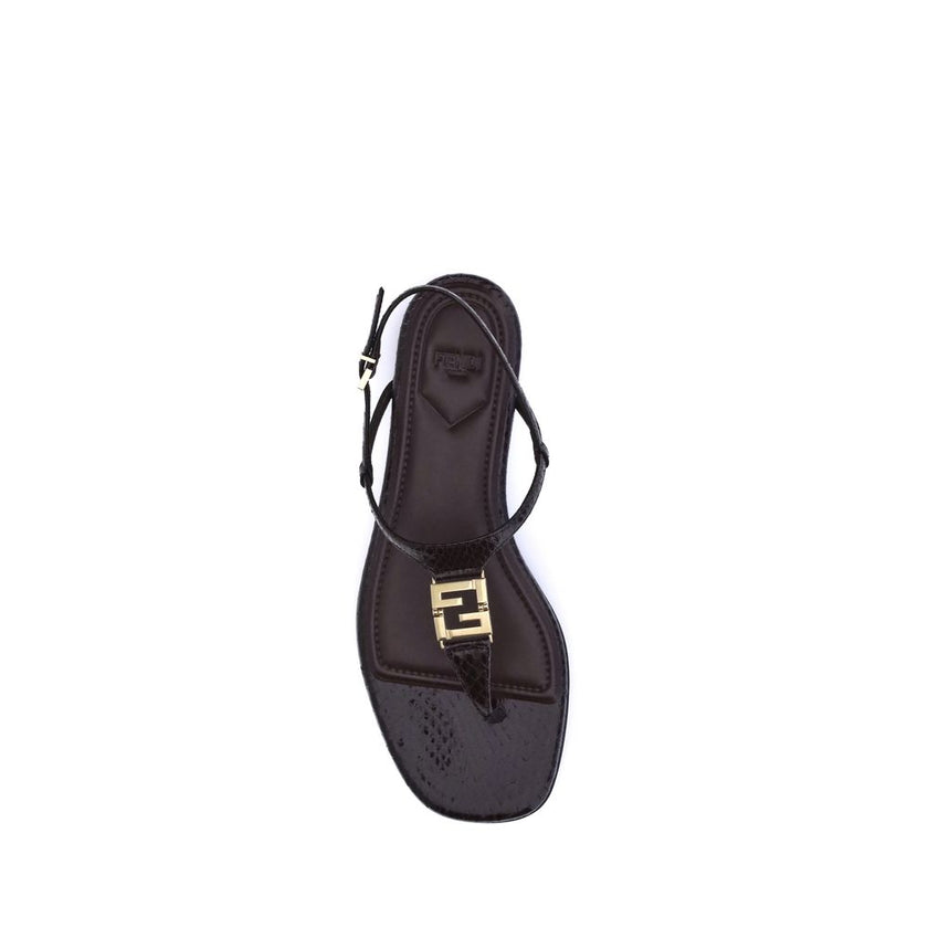 Purple Calf Leather Bos Taurus Flat SandalsFendi’s FFold Sandals are elegant square-toed flip-flops, embellished with a T-bar strap and an adjustable ankle strap. Crafted from dark purple ayers leather, they feature a metal FF detail and a leather insole,