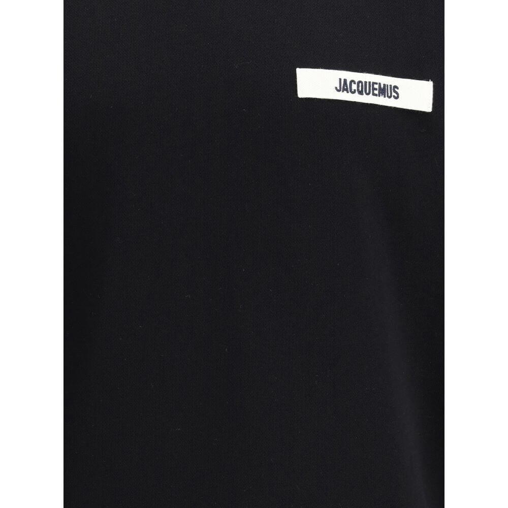Black Cotton SweatshirtJacquemus’ Hooded Sweatshirt, made of soft cotton with a plush interior, offers snug comfort that is ideal for everyday wear. The clean design is embellished with an applied logo patch on the front, adding a distinctive and recogniz