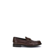 Brown Calf Leather Bos Taurus Slip-On LoafersPrada’s leather Loafers are a mix of classic elegance and distinctive details. The slightly elongated round toe and leather block heel ensure comfort and style. The iconic enameled triangular plaque with the br