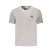 Gray Cotton Men T-ShirtElevate your casual wear with the unmistakable class of Calvin Klein. This short-sleeved gray T-shirt is the epitome of comfort meets style. Sporting a sleek crew neck and emblazoned with an iconic Calvin Klein logo, this tee is an