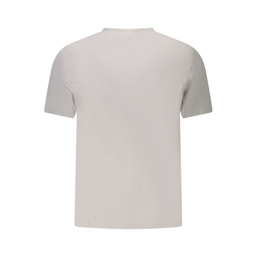 Gray Cotton Men T-ShirtElevate your casual wear with the unmistakable class of Calvin Klein. This short-sleeved gray T-shirt is the epitome of comfort meets style. Sporting a sleek crew neck and emblazoned with an iconic Calvin Klein logo, this tee is an