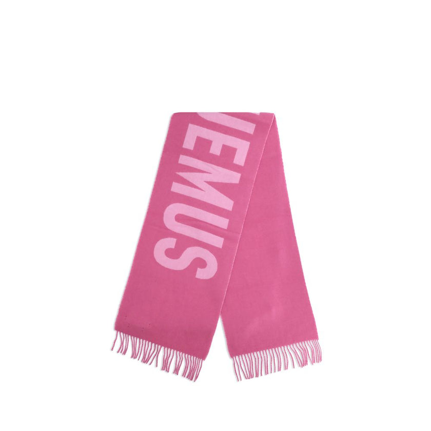 Multicolor Wool ScarfThe Jacquemus Wool Scarf is an essential accessory with a modern and minimal style. Made of solid-colored yarn, it is embellished with a contrasting jacquard logo, which gives character without sacrificing sobriety. The design is comp