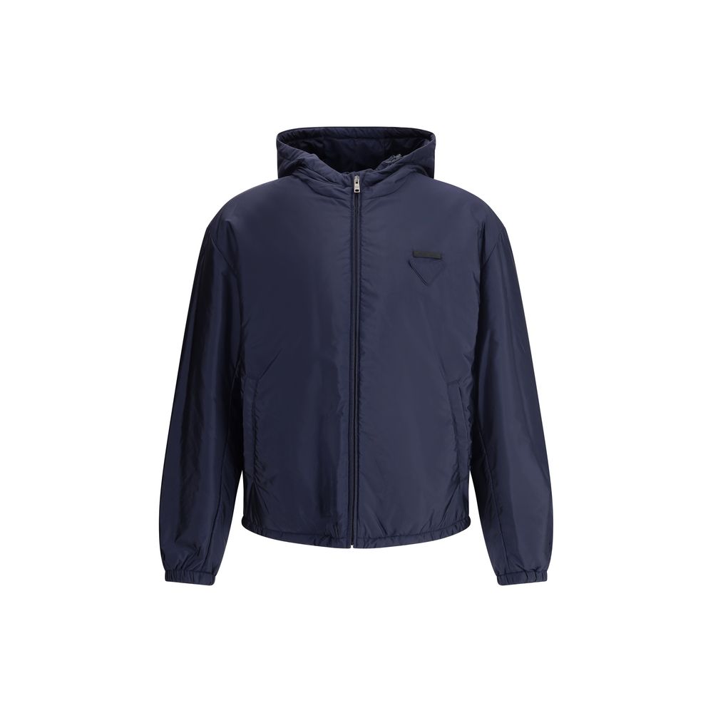 Blue Polyester Full-Length JacketNylon jacket with an all-over quilted design by Prada, perfect for tackling mid-season in style. Featuring an adjustable drawstring hood and front zipper closure, it has two handy side welt pockets and elastic cuffs for a