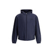 Blue Polyester Full-Length JacketNylon jacket with an all-over quilted design by Prada, perfect for tackling mid-season in style. Featuring an adjustable drawstring hood and front zipper closure, it has two handy side welt pockets and elastic cuffs for a