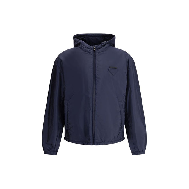 Blue Polyester Full-Length JacketNylon jacket with an all-over quilted design by Prada, perfect for tackling mid-season in style. Featuring an adjustable drawstring hood and front zipper closure, it has two handy side welt pockets and elastic cuffs for a