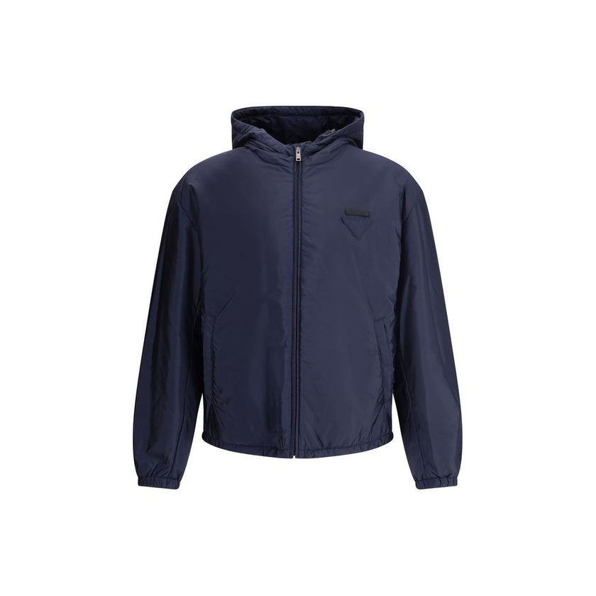 Blue Polyester Full-Length JacketNylon jacket with an all-over quilted design by Prada, perfect for tackling mid-season in style. Featuring an adjustable drawstring hood and front zipper closure, it has two handy side welt pockets and elastic cuffs for a