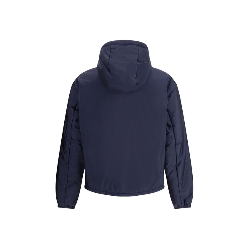 Blue Polyester Full-Length JacketNylon jacket with an all-over quilted design by Prada, perfect for tackling mid-season in style. Featuring an adjustable drawstring hood and front zipper closure, it has two handy side welt pockets and elastic cuffs for a