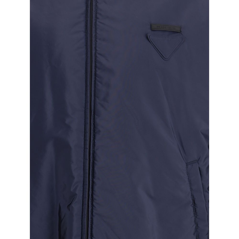 Blue Polyester Full-Length JacketNylon jacket with an all-over quilted design by Prada, perfect for tackling mid-season in style. Featuring an adjustable drawstring hood and front zipper closure, it has two handy side welt pockets and elastic cuffs for a