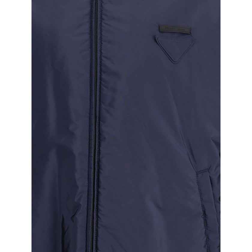 Blue Polyester Full-Length JacketNylon jacket with an all-over quilted design by Prada, perfect for tackling mid-season in style. Featuring an adjustable drawstring hood and front zipper closure, it has two handy side welt pockets and elastic cuffs for a