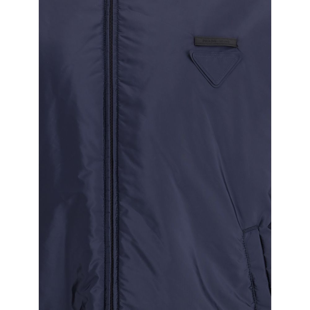 Blue Polyester Full-Length JacketNylon jacket with an all-over quilted design by Prada, perfect for tackling mid-season in style. Featuring an adjustable drawstring hood and front zipper closure, it has two handy side welt pockets and elastic cuffs for a