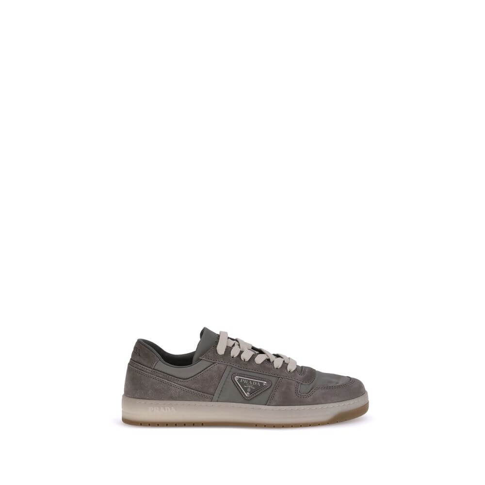 Gray Calf Leather Bos Taurus Low Top SneakersPrada’s suede sneakers are a model that combines discreet elegance and comfort. The soft suede leather gives a sophisticated texture, perfect for a casual yet refined look. The lace-up top closure ensures an ad