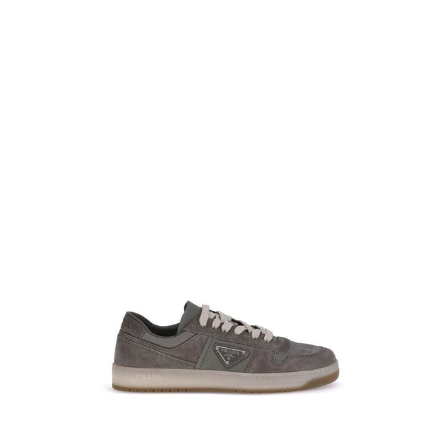Gray Calf Leather Bos Taurus Low Top SneakersPrada’s suede sneakers are a model that combines discreet elegance and comfort. The soft suede leather gives a sophisticated texture, perfect for a casual yet refined look. The lace-up top closure ensures an ad