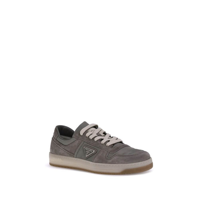 Gray Calf Leather Bos Taurus Low Top SneakersPrada’s suede sneakers are a model that combines discreet elegance and comfort. The soft suede leather gives a sophisticated texture, perfect for a casual yet refined look. The lace-up top closure ensures an ad
