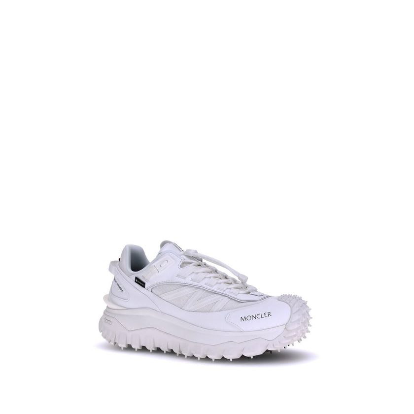 White Polyamide Athletic SneakersMoncler’s Trailgrip GTX Sneakers combine technical performance and urban style in a design designed to tackle any terrain. Made with nylon, Tectuff and leather uppers, they feature a mesh lining with a waterproof GORE-TEX